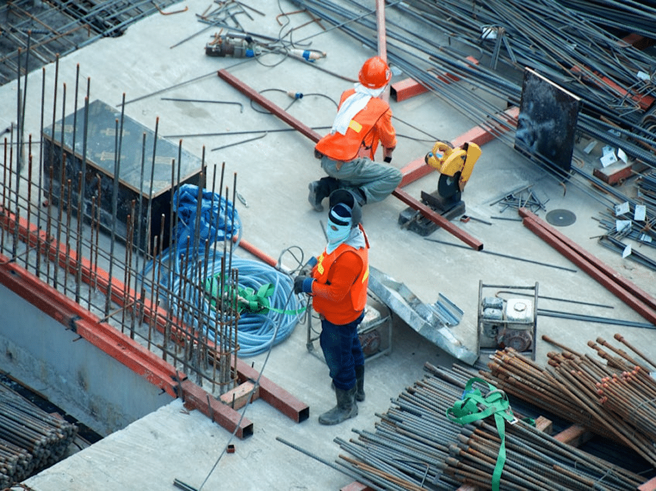 Two project managers coordinating on construction work together